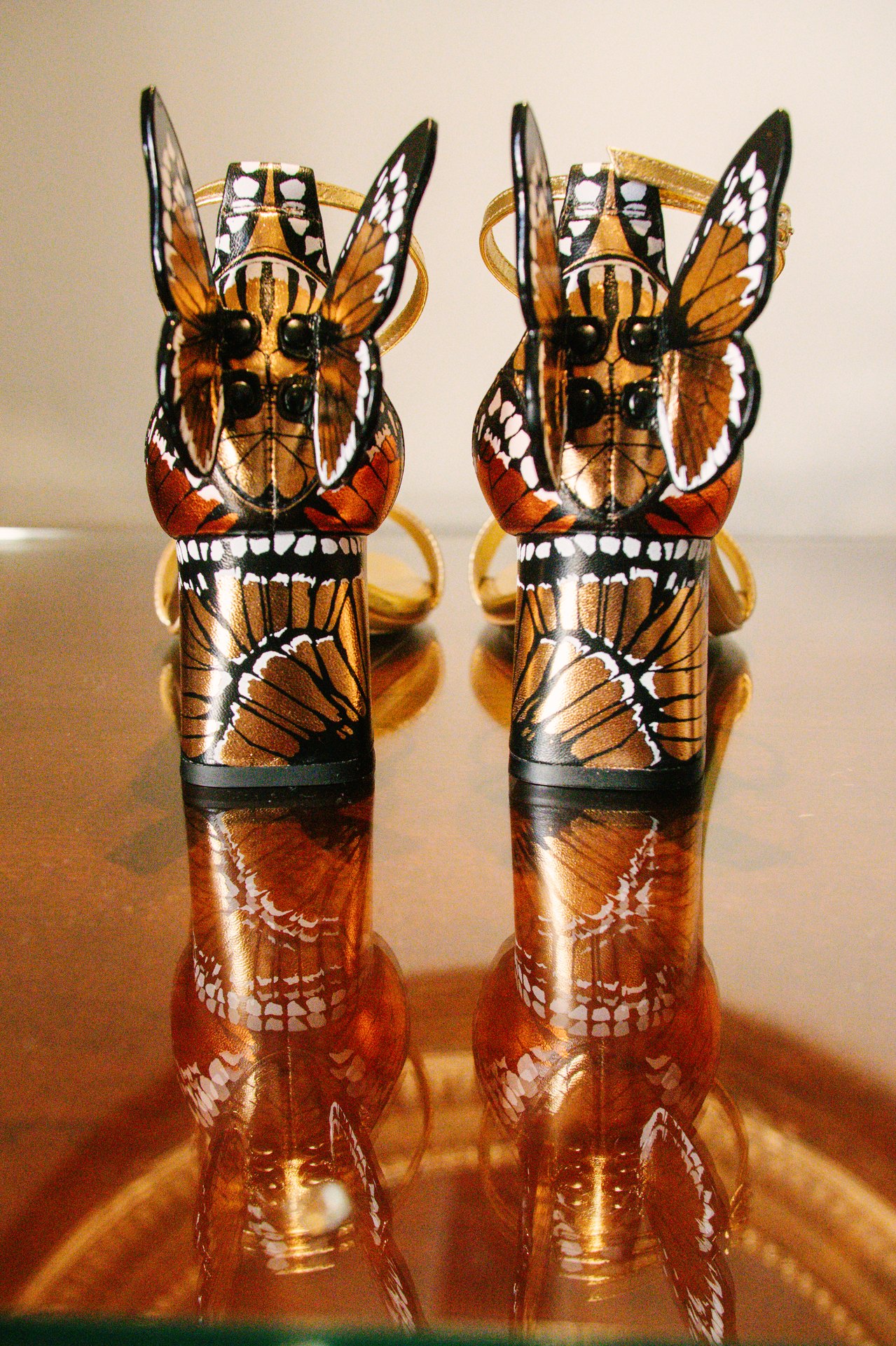 Two patterned animal figurines on a table