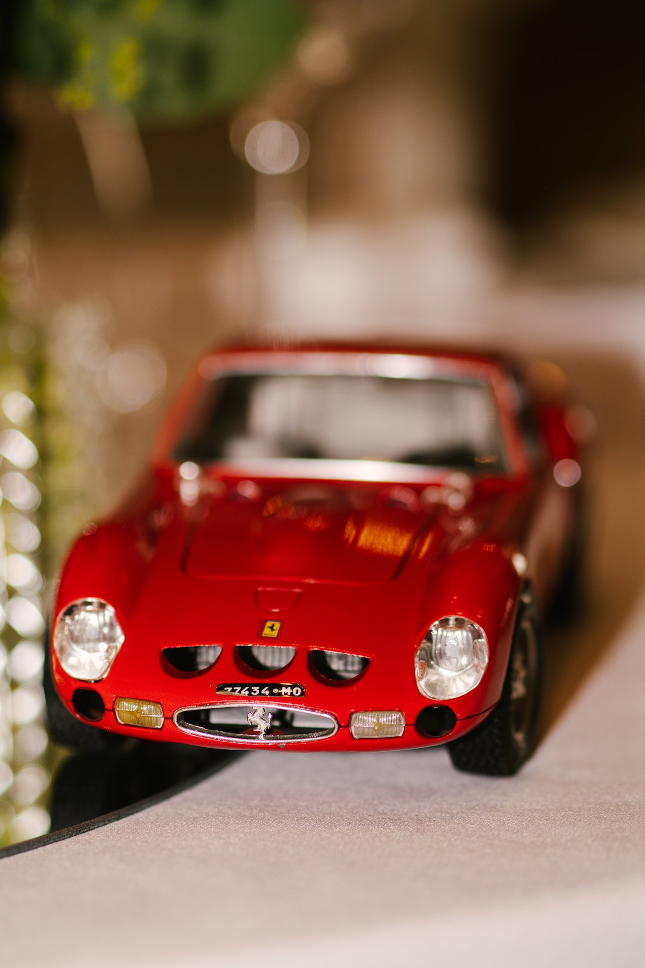 A red model car among the wedding details