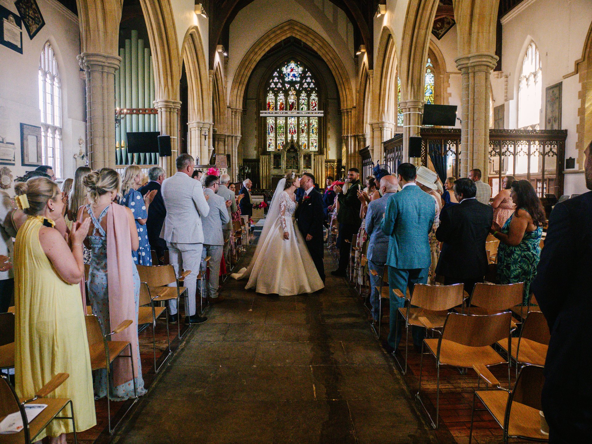 Wedding guests gathered inside All Saints Church in Marlow